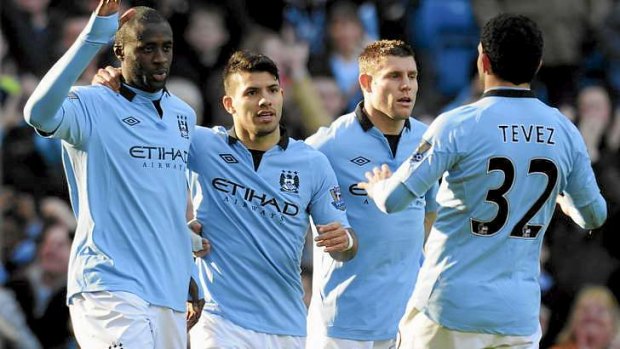 Important trophy: Yaya Toure celebrates with teammates after scoring a goal during Manchester City's run to the FA Cup final.