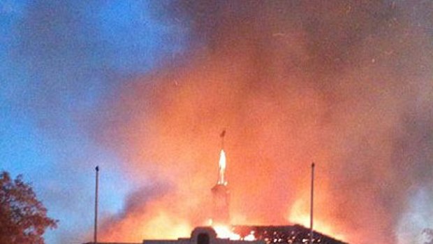 The Claremont Municipal Chambers is engulfed in flames.