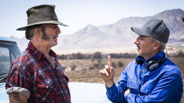 Taking the Mick ... Director Greg McLean (right) on the set of <i>Wolf Creek 2</i> with John Jarratt.