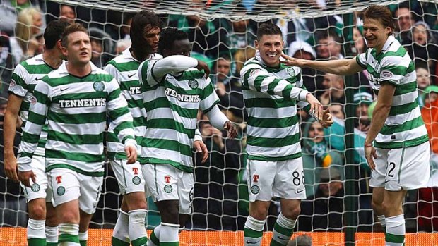 Celtic's Gary Hooper (second right) celebrates with his teammates after scoring his hat-trick.