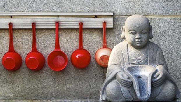 A Buddhist temple's drinking fountain and ladles.