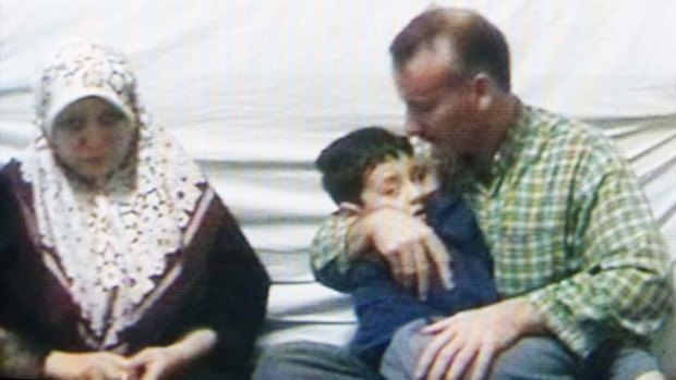 Stills from a <em>Four Corners</em> program on the Villawood Detention Centre. Mohammad Bedraie holds his son, Shayan,6, with mother, Zahra Saberi.