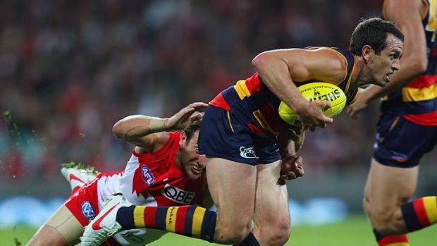 Crow in flight: Adelaide's Michael Doughty takes off with the ball.