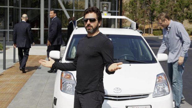 No hands &#8230; Google's Sergey Brin in front of a self-driving car.