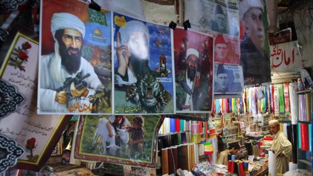 Hero to some ... images of Osama bin Laden are displayed for sale in Quetta, the capital of the Pakistani province of Baluchistan, near the Afghan border.