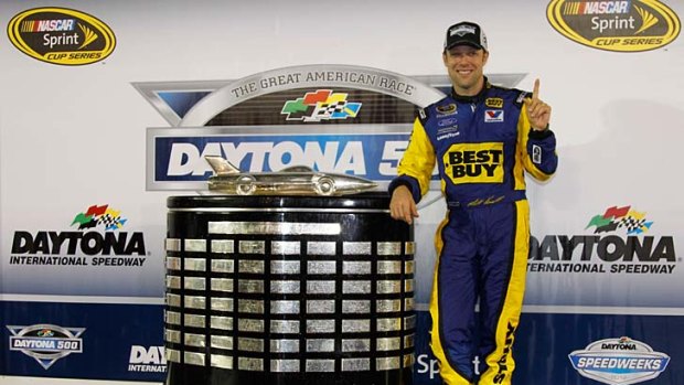 Matt Kenseth poses with the Harley J. Earl Trophy in Victory Lane after winning the NASCAR Sprint Cup Series Daytona 500.