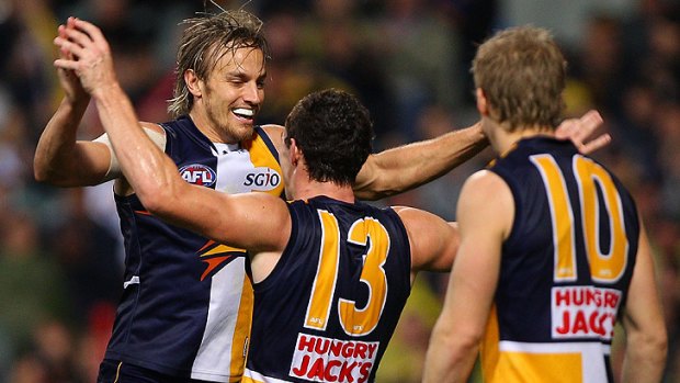 Mark Nicoski (left) won't be celebrating any goals until half-way through the AFL season after he was discovered today to have suffered a torn hamstring tendon.