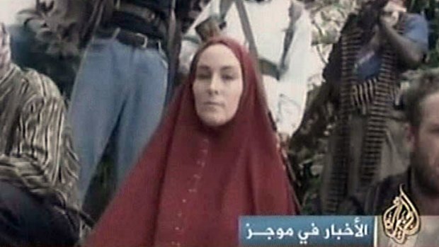 Amanda Lindhout and her captors appear in a video handed to Arabic news agency Al Jazeera.