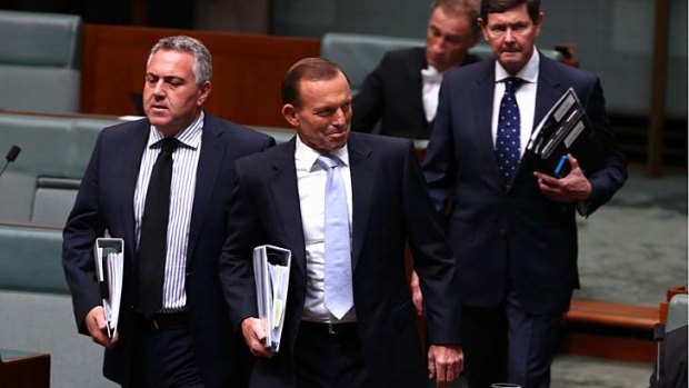 Treasurer Joe Hockey and Prime Minister Tony Abbott arrive for question time together, ahead of the cabinet meeting on Monday evening.
