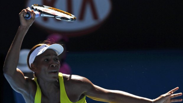 Venus Williams of the U.S. returns a shot against Italy's Francesca Schiavone.