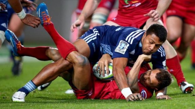Flattened: Quade Cooper and the Reds were given a torrid time by the Blues in Auckland.