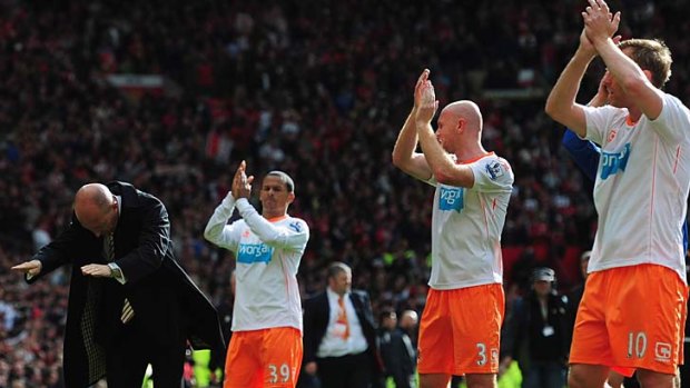 Going down ... Blackpool manager Ian Holloway and his players salute the fans.