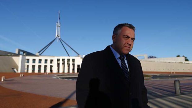 Treasurer Joe Hockey does breakfast television interviews on the front lawns of Parliament House after budget day.