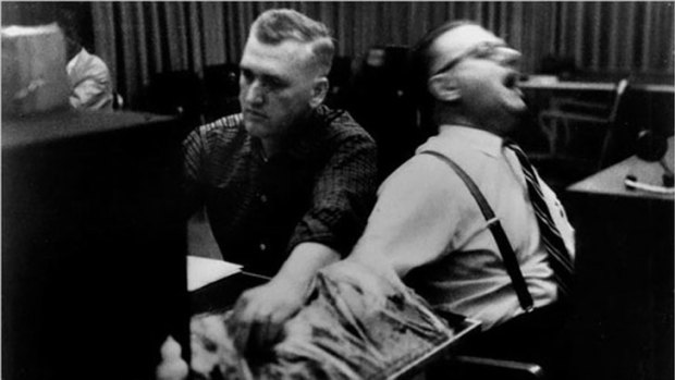 A still from the <i>Obedience</i> film documenting the research of Stanley Milgram.