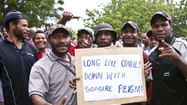 On message &#8230; protesters show their support for Peter O'Neill at a demonstration in Port Moresby.