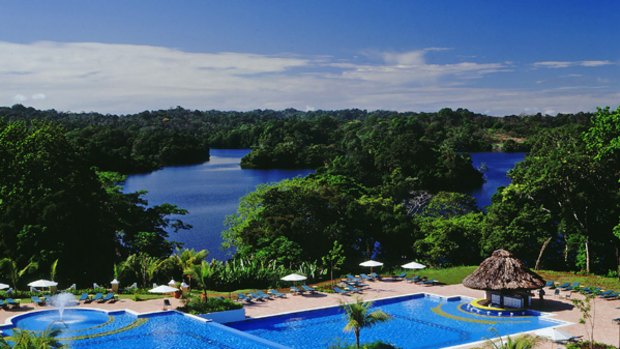 Water torture ... beyond the hotel pool lies dense jungle.