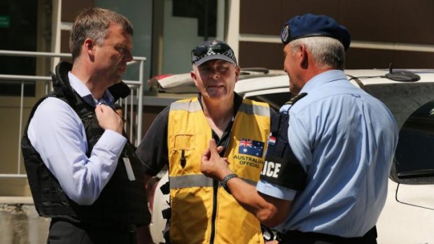 Kiev's gamble: Deputy chief of the OSCE mission Alexander Hug, left, talks with a members of the Australian contingent in Donetsk.