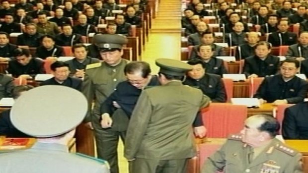 North Korean television released images that it said showed Jang Song-thaek being dragged from his chair by two police officials during a meeting in Pyongyang. North Korea.
