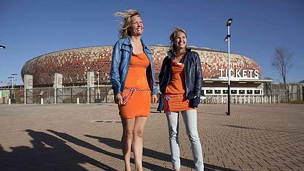 Ale and arty ... The two Dutch women, Barbara Castelein, left, and Mierte, outside the soccer stadium in Johannesburg.