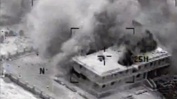 Video released by US Central Command shows a building in Tall Al Qitar, Syria, moments after a US airstrike.