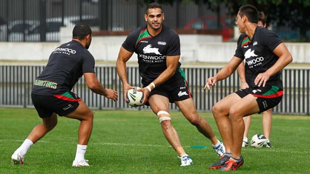 Target: Greg Inglis came in for extra attention from Manly. Right, Sam Burgess.
