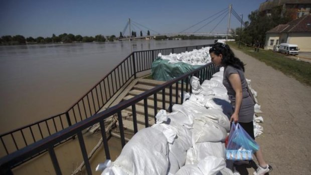 Not out of danger yet ... A woman looks at the River Sava in Sremska Mitrovica, west of Belgrade, Serbia.