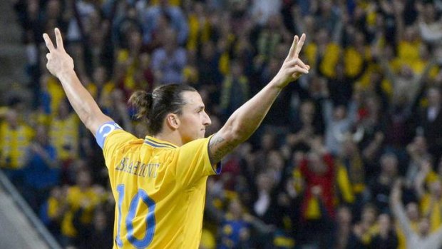 Zlatan Ibrahimovic celebrates his third goal for Sweden.