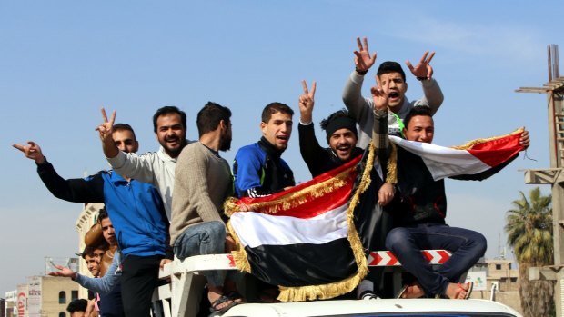 Iraqis take down to the streets of Baghdad to celebrate Iraq's penalty-shootout win over Iran in Canberra.