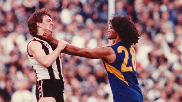 Key role: West Coast star Chris Lewis tangles with Collingwood's Mick McGuane.