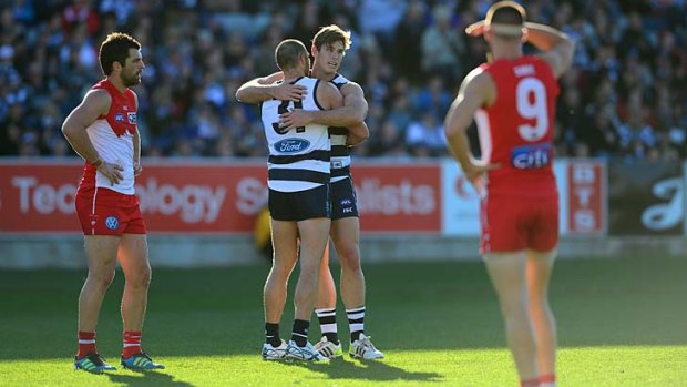 Cats whiskers: Tom Hawkins and James Podsiadly celebrate another Geelong goal.