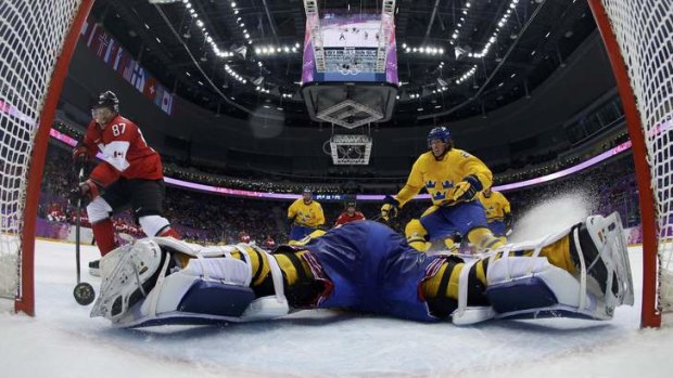 Golden touch: Canada's Sidney Crosby rounds Sweden's goalie Henrik Lundqvist to score in the Olympics final.