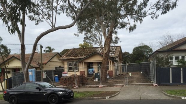 Dea and Darren Jolly's home as it was being demolished.