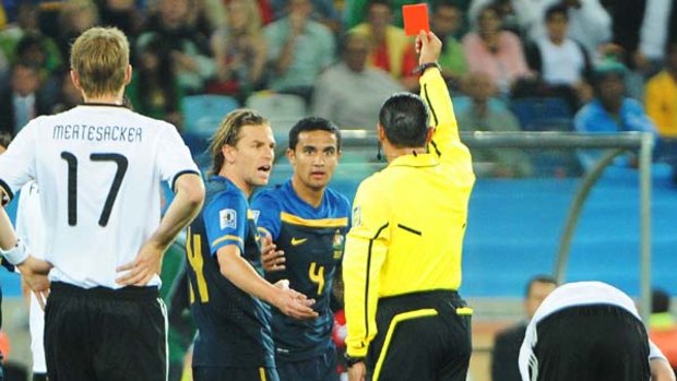 Sent off ... Tim Cahill is shown a straight red card following a tackle on Bastian Schweinsteiger.
