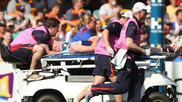 Tom Lynch is stretchered off with a neck injury.