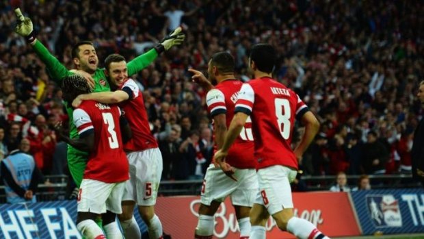 Fabianski of Arsenal celebrates winning the penalty shoot out with teammates.