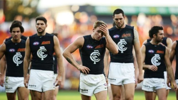 What went wrong? Carlton players after losing to the Greater Western Sydney Giants on Sunday.