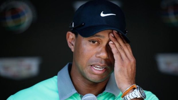Hurting: Tiger Woods will miss the Masters because of back surgery to fix a pinched nerve. He hopes to be back competing by June.
