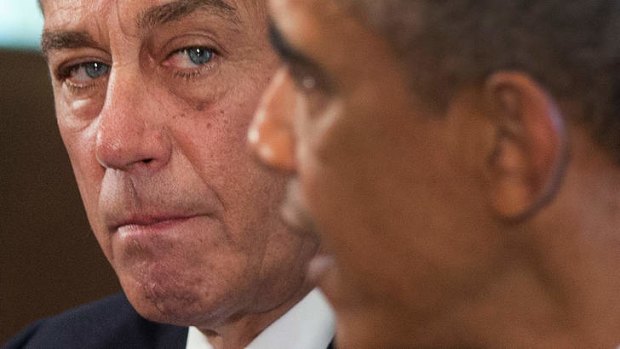 House Speaker John Boehner of Ohio listens as President Barack Obama speaks to media, in the Cabinet Room of the White House in Washington. Mr Boehner said he will support the president's call for the US to take action against Syria for alleged chemical weapons use.