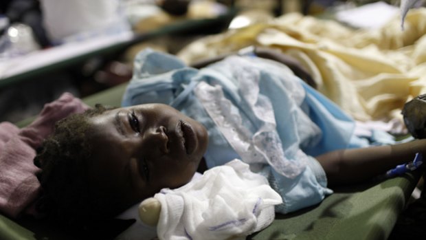 Crisis … Betina Joseph, 5, has life-threatening tetanus but the US military has suspended airlifts because of a dispute over costs.