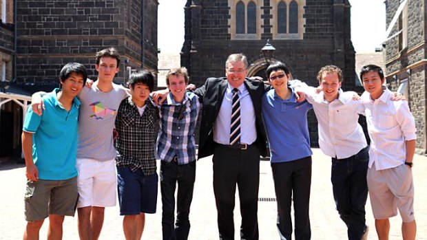 Melbourne Grammar's seven top scorers. Left to right, Bernard Shan, Walter Myer, Nicholas Tang, Cameron Venus, Headmaster Roy Kelley, Colin Lu, Fergus Peace and Henry Li.