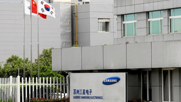 The Chinese and South Korea flags fly outside a Samsung facility in Suzhou on September 5, 2012.