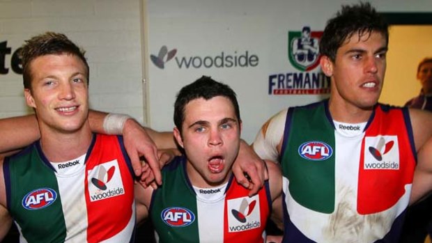 Winning is fun, but then you heave to heave-ho: Rhys Palmer, Hayden Ballantyne and Garrick Ibbotson do their Dockerly duties post-match.
