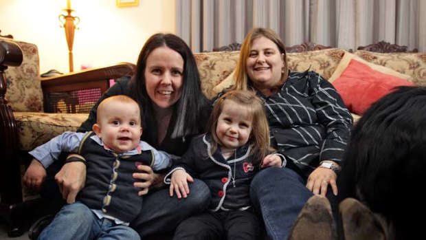 Carlene Tolley and Gail Conman with their children Charlotte and Alexander.