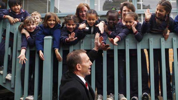 Tony Abbott greets students at Nunawading Christian College in Nunawading.