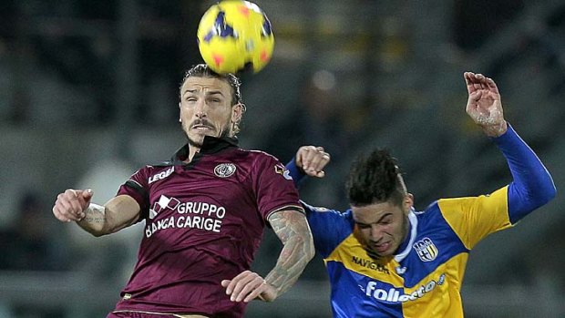 Paulinho of AS Livorno Calcio fights for the ball with Pedro Mendes of Parma FC.