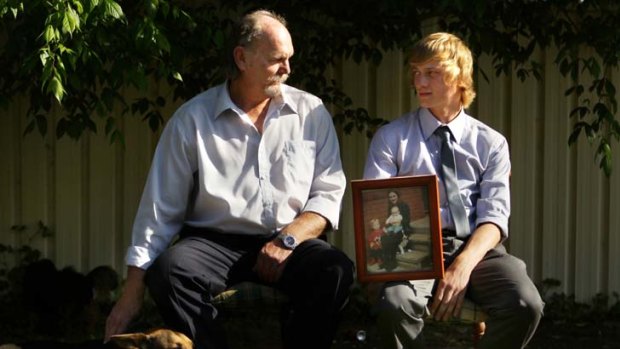 Old wounds ... Mark Wearne with Cody, 16, at their home.