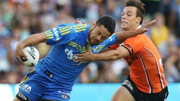 Wests Tigers halfback Luke Brooks tries to reel in Jarryd Hayne during the Easter Monday blockbuster at ANZ Stadium.
