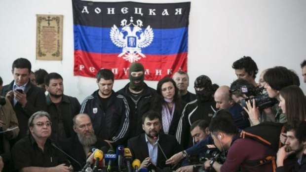 Denis Pushilin, third from left, during a news conference in Donetsk.