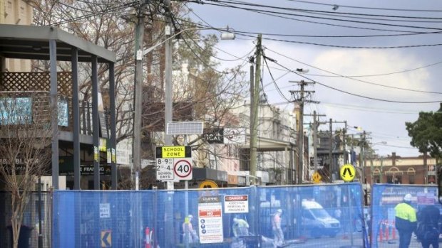 No-go zone: the scene on Sunday as residents and business owners of Balmain and Rozelle await clearance to return to the closed site of last week's explosion in Darling Street.