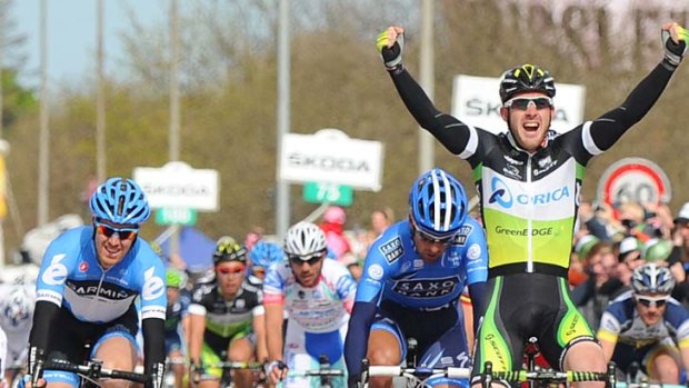 Matt Goss of Australia celebrates after crossing the finish line of the third stage of the Giro d'Italia.